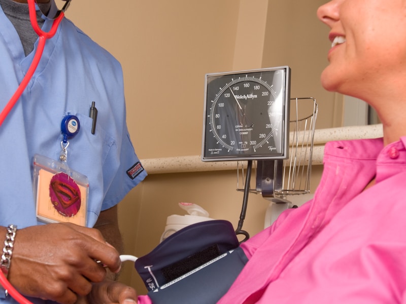 A radiologist reviewing a head CT scan on a workstation.